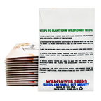 Stack of wildflower seed packets with planting instructions on a white background